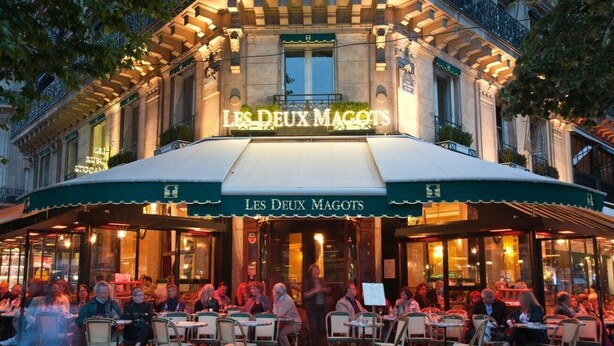 An outdoor cafe named "Les Deux Magots" with outdoor seating and a classic architectural facade. - IMMERSE YOURSELF IN THE AUTHENTIC PARISIAN LIFESTYLE AT BLVD SAINT GERMAIN (Paris)