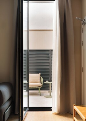 Studio with sofa bed | Living area | 50-inch flat-screen TV with cable channels