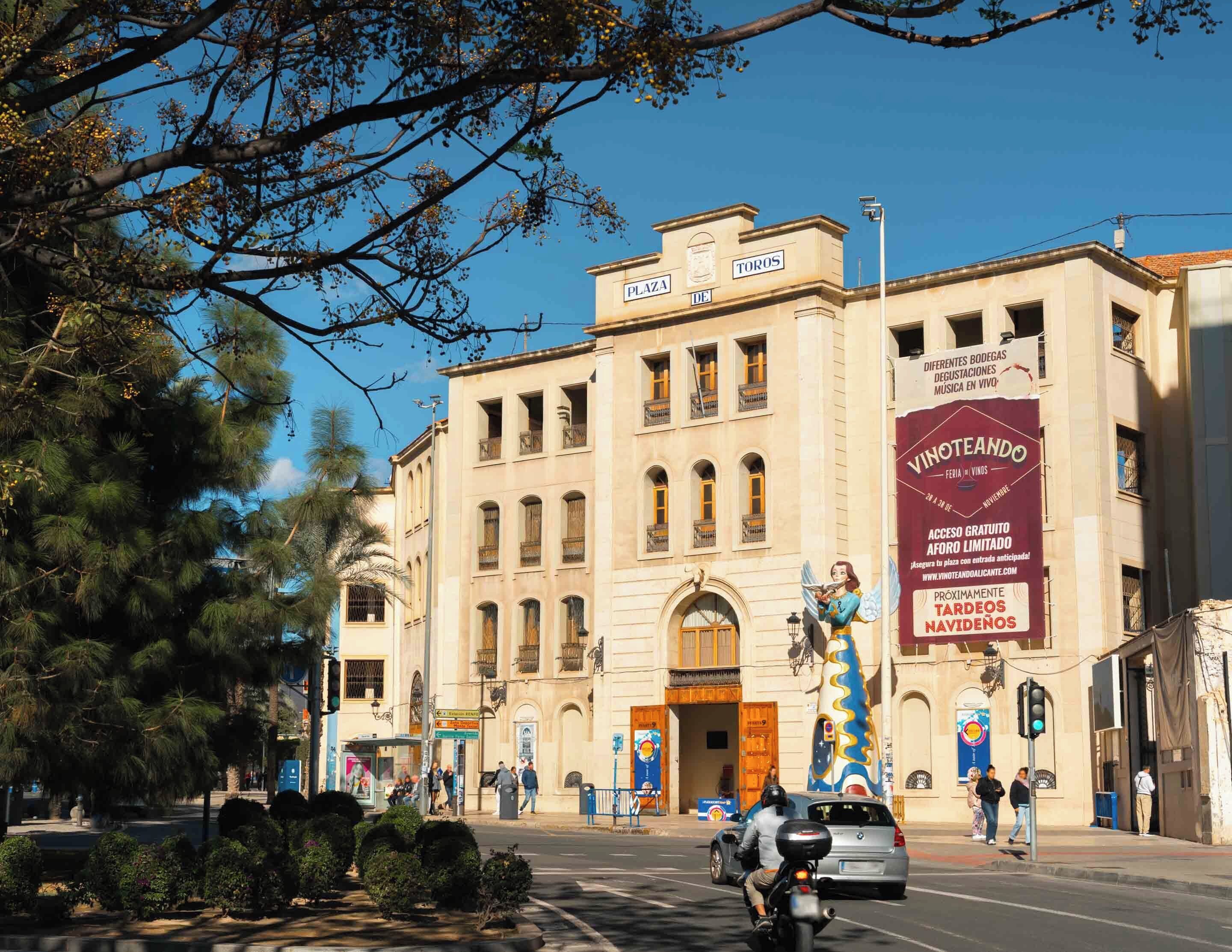 A building with a classical architectural style, featuring a prominent entrance with a large door and multiple windows.