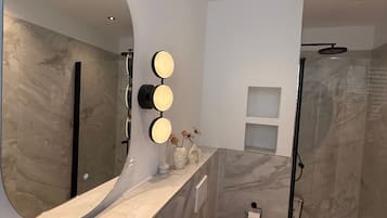 Shower, towels, soap, toilet paper