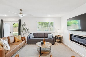 TV, fireplace, offices - Bright Modern Home | 3BR, 2BA, Fenced Backyard (Irving)
