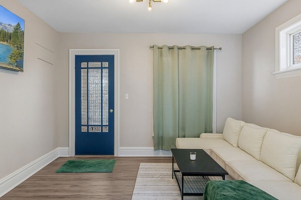 living room features a comfortable sofa, modern décor, and a smart TV—perfect for relaxing after a day of sightseeing.