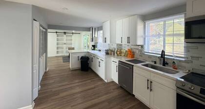 Experience a modern retreat with room for everyone! This 5-bedroom home offers a king suite, pool table, and fast Wi-Fi, making it ideal for family gatherings or group getaways