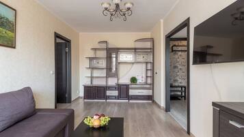 Classic Apartment, Balcony, Courtyard View | Living area | 40-inch LCD TV with digital channels