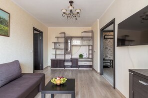 Classic Apartment, Balcony, Courtyard View | Living area | 40-inch LCD TV with digital channels