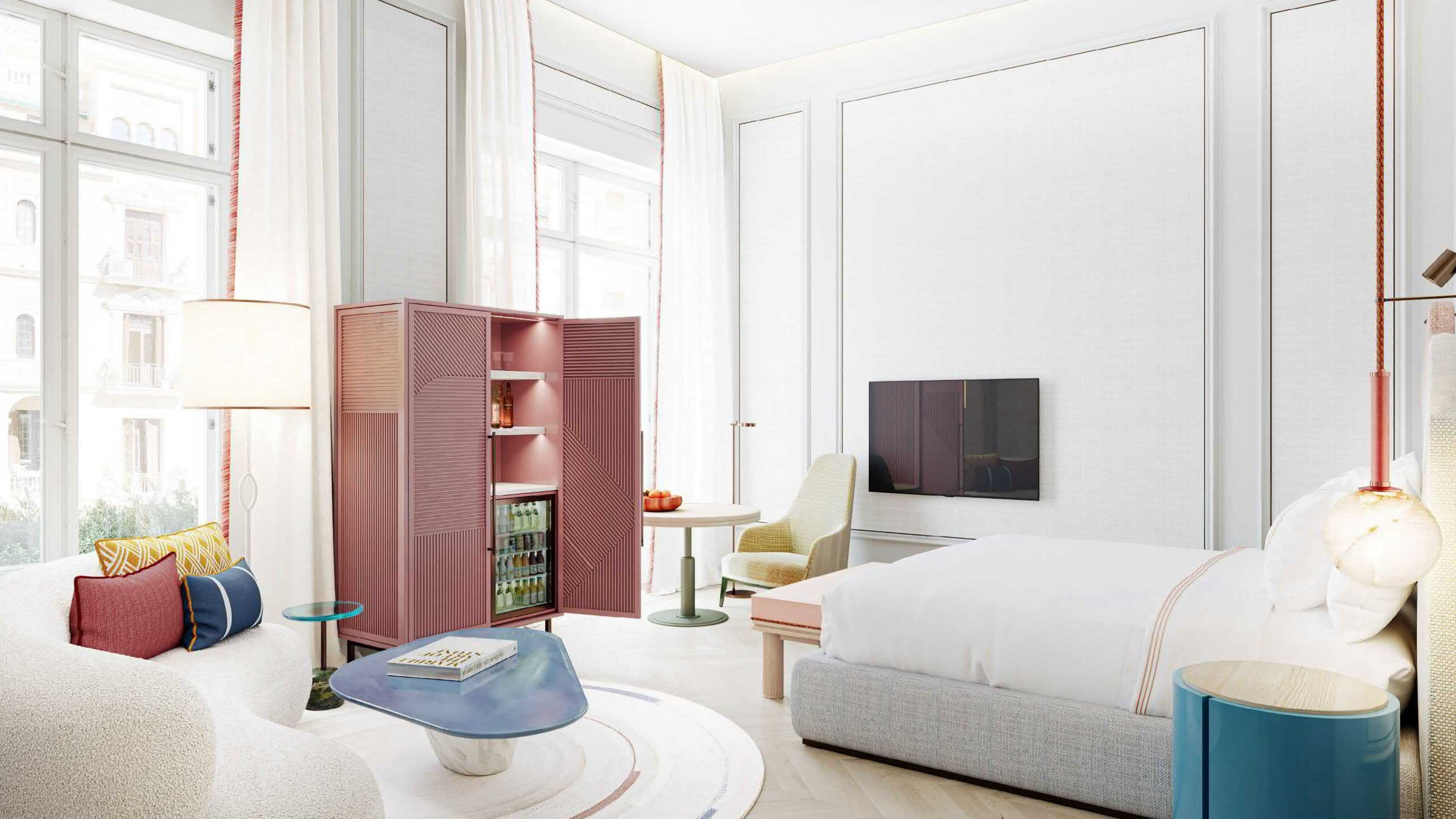 Een minibar, een kluis op de kamer, een bureau, geluiddichte muren