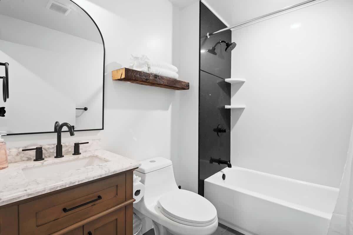 Shower, hair dryer, towels, shampoo