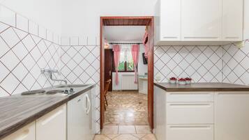 Fridge, coffee/tea maker, cookware/dishes/utensils