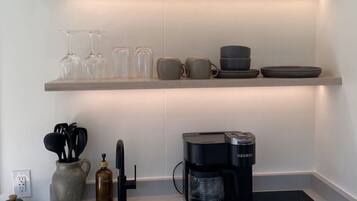 Fridge, stovetop, coffee/tea maker, cookware/dishes/utensils