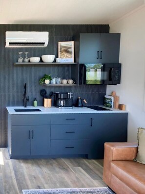 Fridge, microwave, stovetop, coffee/tea maker