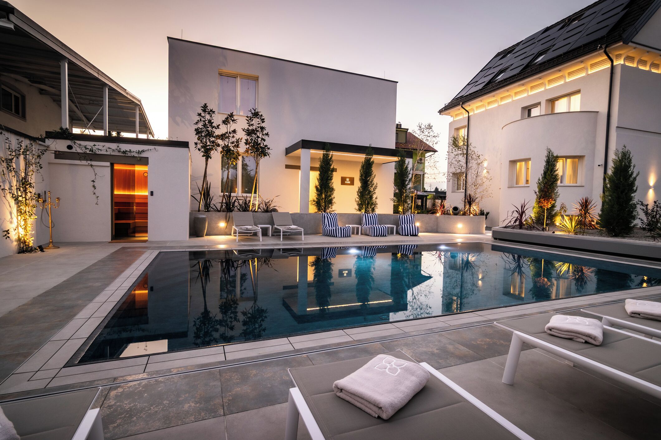 Seasonal outdoor pool, open 9:00 AM to 8:00 PM, pool umbrellas