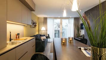 Suite – deluxe, kjøkken | Eget kjøkken | Kjøleskap, kokeplater, oppvaskmaskin og espressomaskin