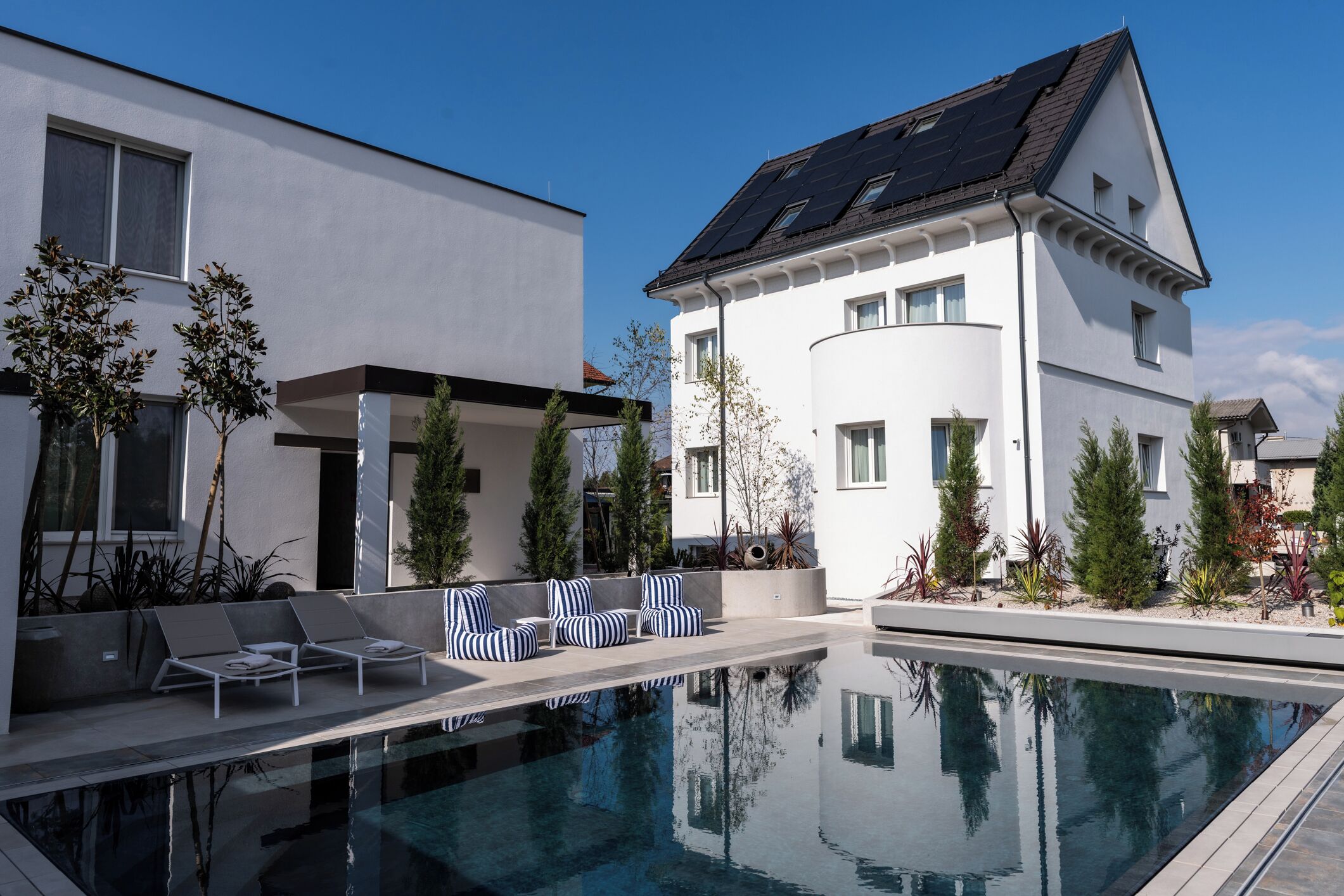 Seasonal outdoor pool, open 9:00 AM to 8:00 PM, pool umbrellas