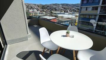 Apartamento | Restaurante al aire libre