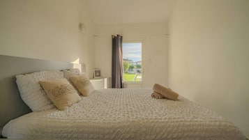 1 bedroom, desk, iron/ironing board, travel crib