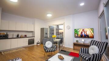 Apartment, 2 Bedrooms, Balcony, City View | Living area | 41-inch flat-screen TV with cable channels, Netflix, streaming services