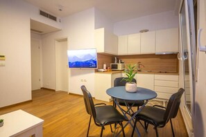 Comfort Apartment, City View | Private kitchen | Fridge, microwave, stovetop, cookware/dishes/utensils