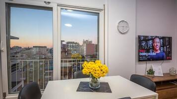 Apartment, 2 Bedrooms, Balcony, City View | Living area | 41-inch flat-screen TV with cable channels, Netflix, streaming services