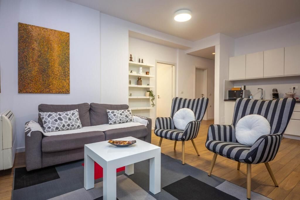 Apartment, 2 Bedrooms, Balcony, City View | Living area | 41-inch flat-screen TV with cable channels, Netflix, streaming services