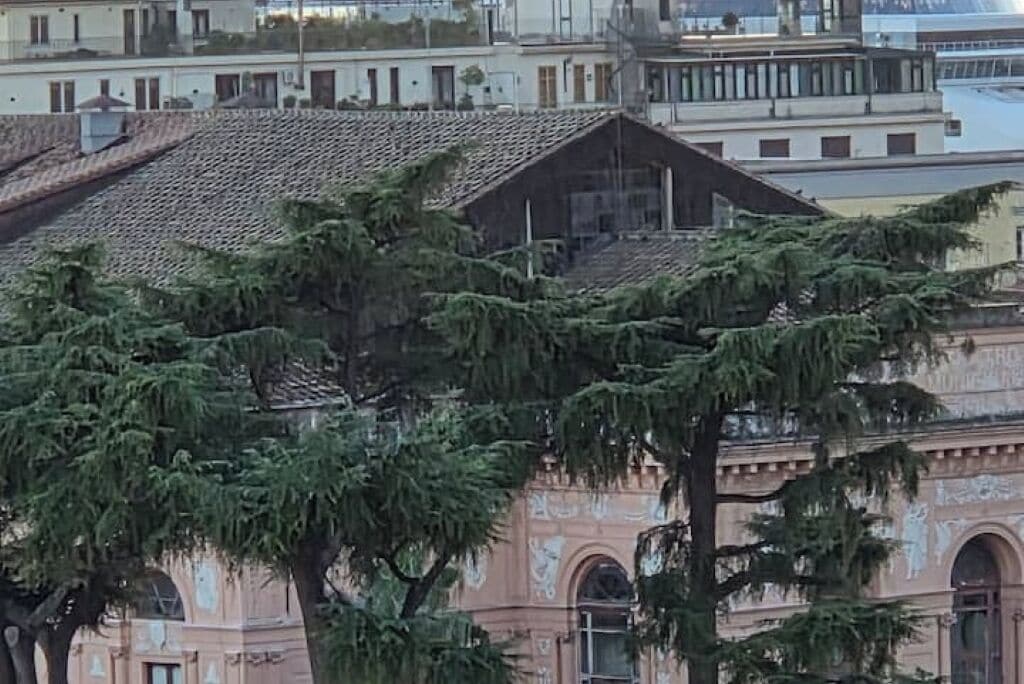 A building with a tiled roof and arched windows.