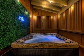 Private covered hot tub with string lights and cozy spa vibes - TheGrandOldOsprey | HotTub+GameRoom 2 min Parkway! (Pigeon Forge)