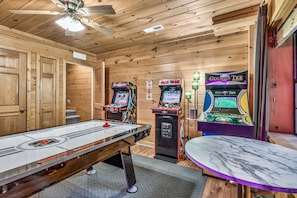 Rustic game room with air hockey and classic arcade fun - TheGrandOldOsprey | HotTub+GameRoom 2 min Parkway! (Pigeon Forge)