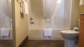 Combined shower/tub, hair dryer, towels, soap