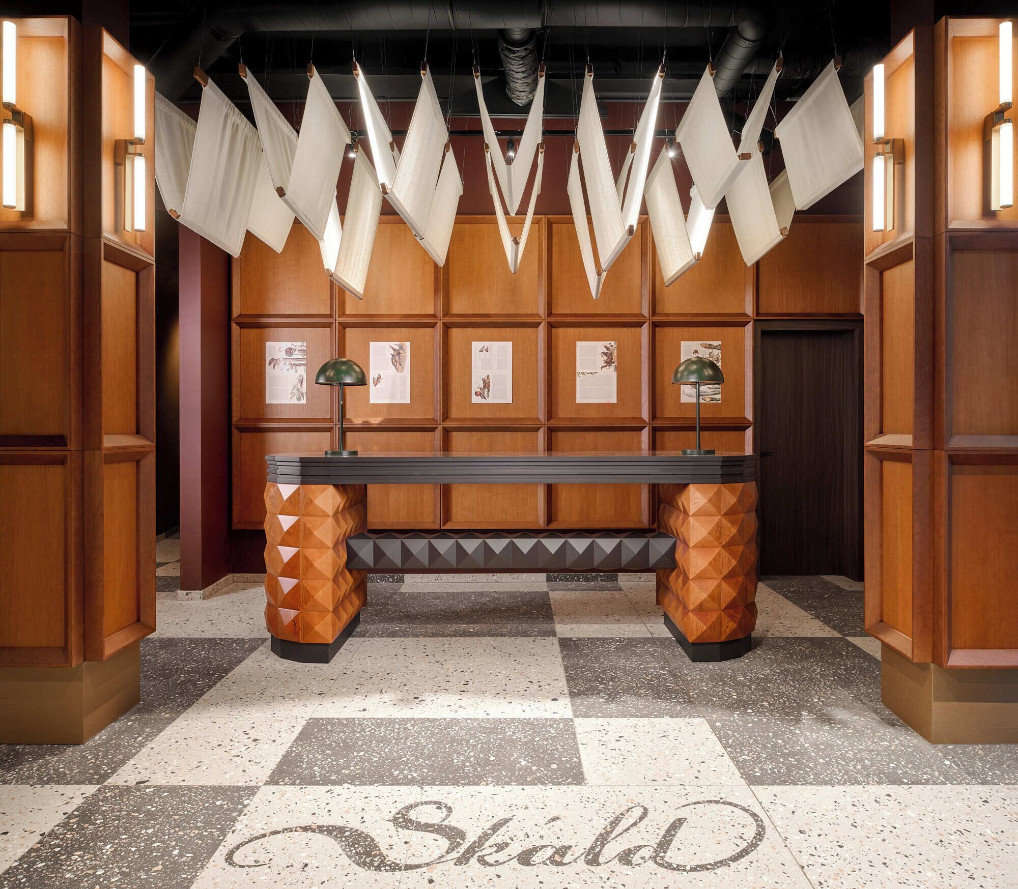 A reception area with a bench, wooden panel walls, and a checkered floor.
