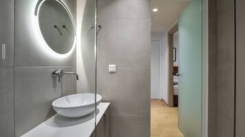 Superior Apartment Suite, Sea View | Bathroom | Shower, hair dryer, slippers, towels
