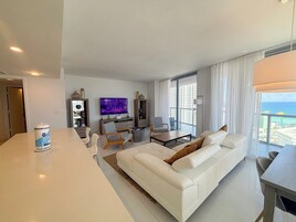 Luxury Apartment, City View | Living area | 43-inch TV with digital channels