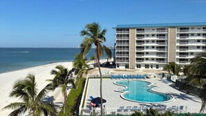 A hotel with a pool, beach, and ocean view. - Oceanfront Condo at Bonita Beach Club – Pool, Tennis, Private Beach Access! (Bonita Springs)