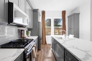 Dishwasher, coffee/tea maker, electric kettle, blender - Designer 4BR Skyline Home w/ Rooftop & EV (Houston)