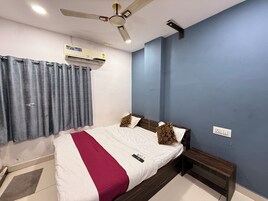 Deluxe Double Room, City View | In-room safe, blackout drapes, soundproofing, iron/ironing board