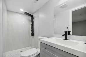 Shower, hair dryer, towels, soap