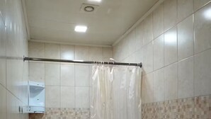 A bathroom with a shower, toilet, and sink. - 21 Apartment in Yerevan 01 (Yerevan)