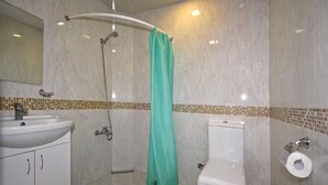 A bathroom with a shower, toilet, and sink. - 21 Apartment in Yerevan 1 (Yerevan)