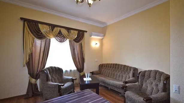 A living room with two sofas, a coffee table, and a chair. - 21 Apartment in yerevan 02 (Yerevan)