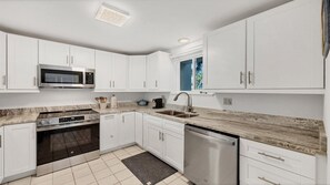 Coffee/tea maker, toaster, dining tables