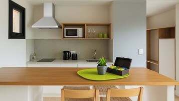 Mini-fridge, microwave, stovetop, cookware/dishes/utensils