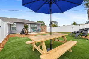 Outdoor dining - 2BR King, Private Fenced Yard w/Turf, Grill, Dog Friendly, Near Pensacola Beach (Gulf Breeze)