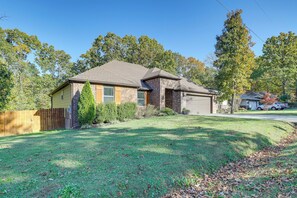 A single-story house with a brick exterior and a sloped roof. - Rider’s Retreat! Modern Home By Bella Vista Trails (Bella Vista)