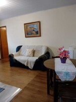 Apartamento, vista para a cidade | Área de estar