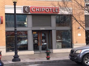 A Chipotle restaurant with a fire hydrant in front, located at 1045. - Downtown Large Apartment Guest Suite (Washington)