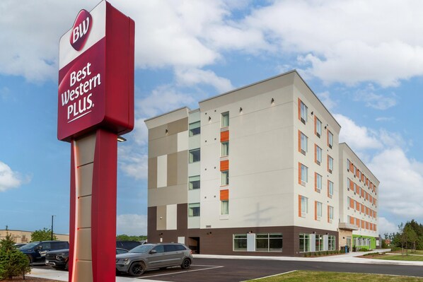 A multi-story hotel with a sign reading 'Best Western PLUS.'
