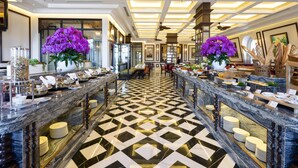 A luxurious hotel lobby with marble flooring, elegant chandeliers, and floral centerpieces. - Best Western Premier Imperial Dalat (Lam Vien - Da Lat)
