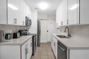 Coffee/tea maker, fridge, microwave, oven