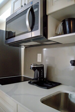 Fridge, microwave, stovetop, coffee/tea maker