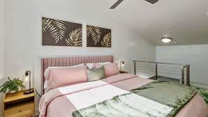 A bedroom with a bed, a nightstand, a ceiling fan, and wall art. - NEW-KING Bed Loft Apartment / Downtown/ Free Garage Parking/ GYM (Salt Lake City)