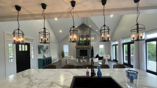 A spacious kitchen with a large island, marble countertops, and pendant lighting. - Escape to Country Comfort

Perfect for a romantic escape, or family retreat. (Iroquois)