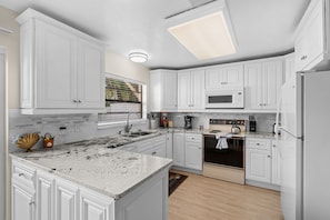 Fridge, microwave, oven, stovetop - Beautiful Beachside House with Outdoor Patio, BBQ — Short Walk to the Shore! 🏖️ (Cape Canaveral)